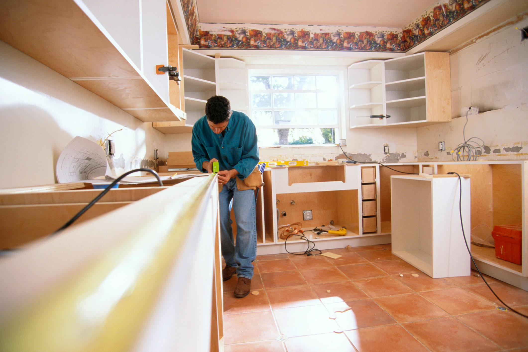 man measuring a counter