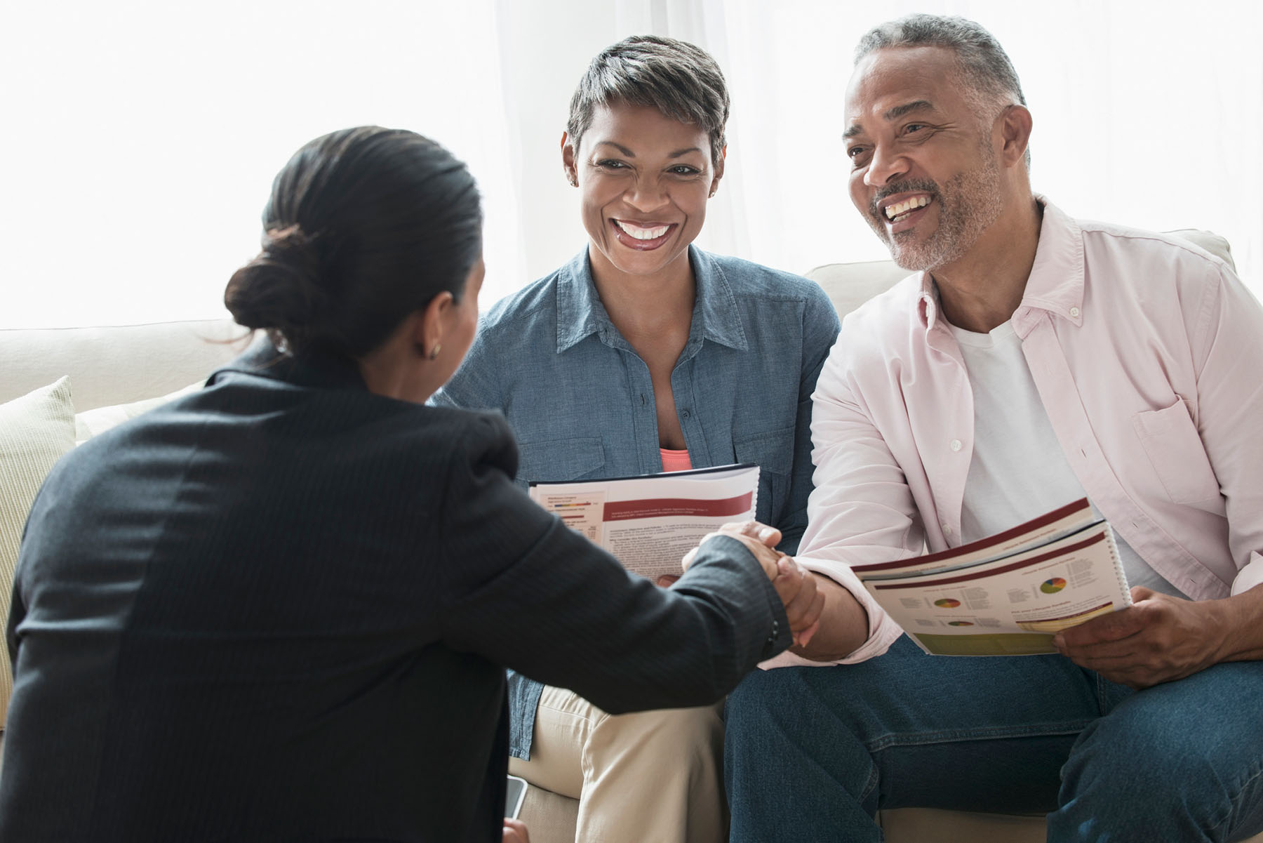 Couple reviewing retirement plans with a retirement consultant