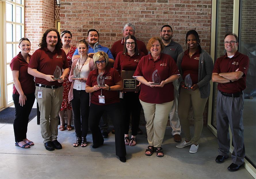 American Heritage Marketing and Business Development Department Displays the Dora Maxwell Service Award and “Benny” Awards.