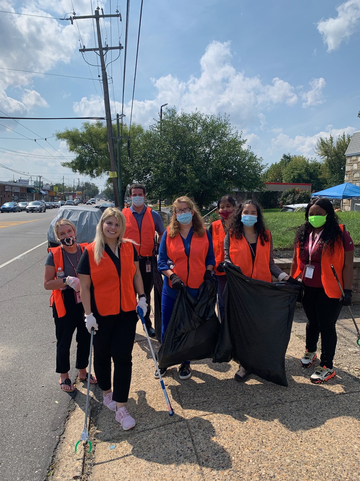 Credit Union volunteers pick up along Frankford Avenue.