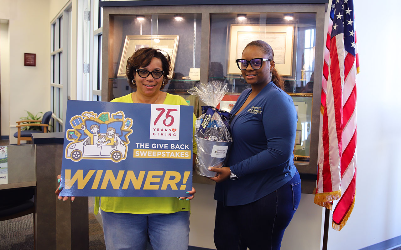 American Heritage awarded Traci Rochon (Left) with the first quarterly $15,000 vacation prize.